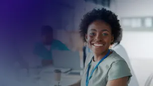 Company female professional smiling happily at camera.