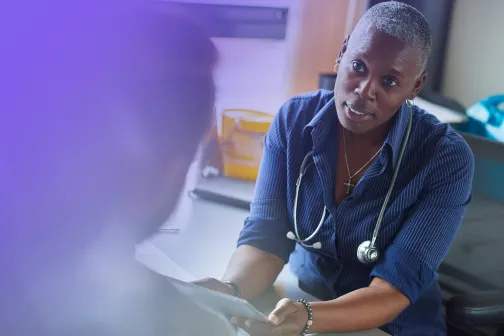 Female doctor in consultation with a patient.